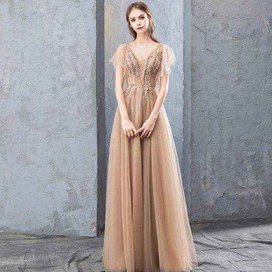 Vestidos en dorado para invitadas - 1