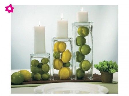 centro de mesa con limones, limas y velas