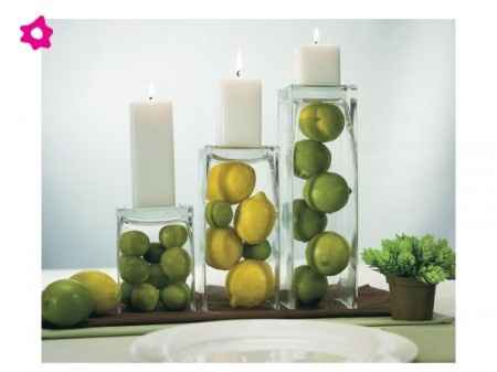 centro de mesa con limones, limas y velas