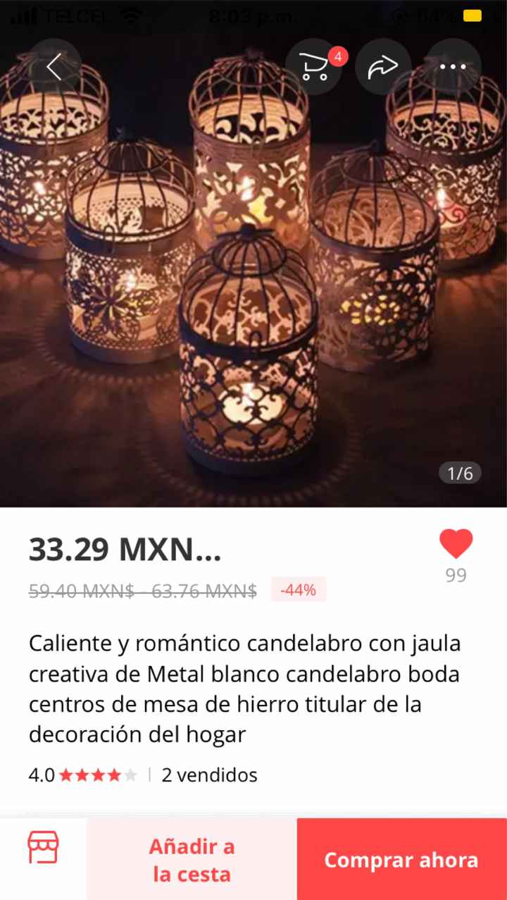 Jaulas con flores como centros de mesa - 1