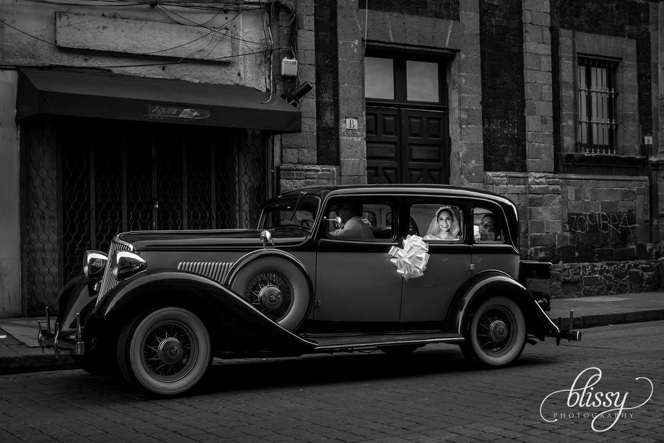 Bride arriving in classic car