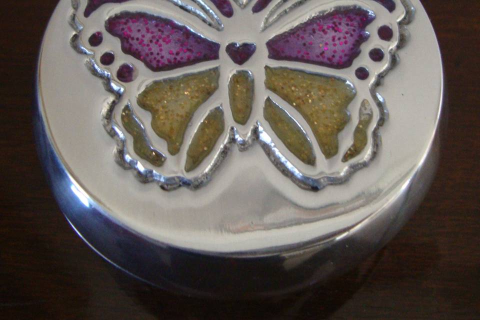 Alhajero mariposa con resina