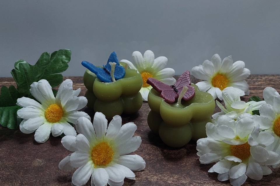 Velas verdes con mariposa