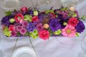 Decoración en centro de mesa con flores exóticas