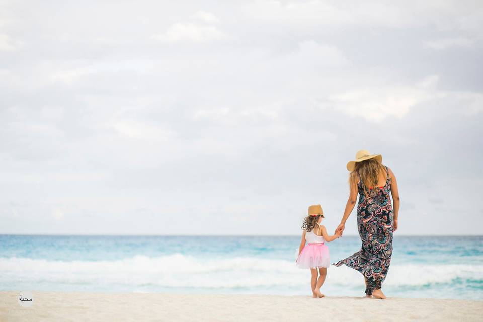 Mother and daughter by the sea