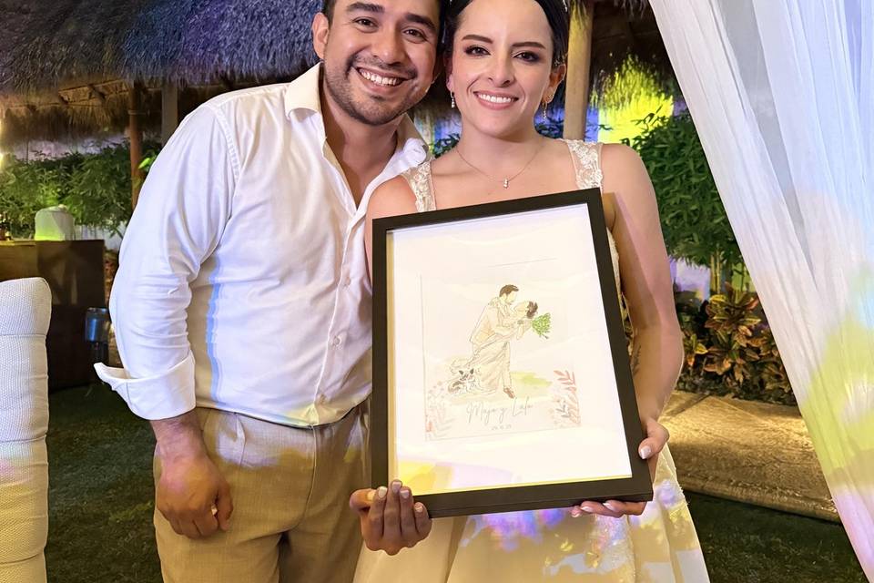 Novios con su cuadro